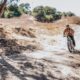 A fat tire electric bike equipped with an intelligent hybrid control system riding on a rugged trail.